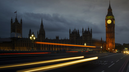 Obraz na płótnie Canvas LONDON, UK - APRIL: Traffic and pedestrians on Westminster Bridge near Big Ben and Parliament