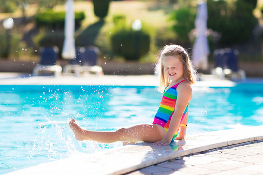 Child in swimming pool on summer vacation