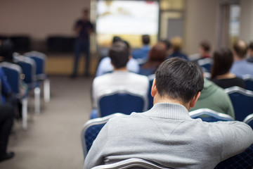 The image of a conference in a conference hall