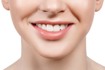Close up of beautiful wide smile of young fresh woman with great healthy white teeth. Isolated over white background