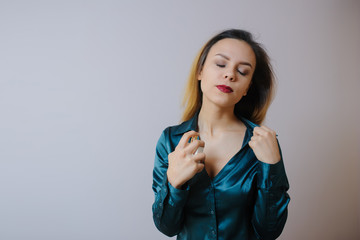 young woman applying perfume