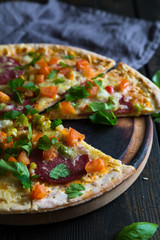 Pizza with salami and vegetables