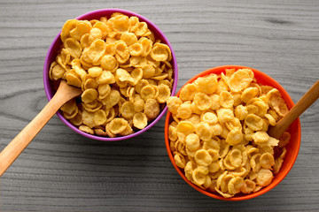 cornflakes in bowls on a gray laminate