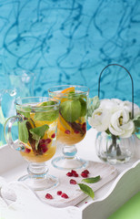 Herbal tea with sliced orange, mint and cinnamon