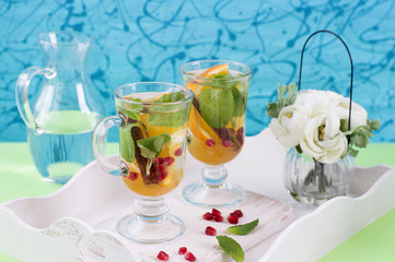 Herbal tea with sliced orange, mint and cinnamon
