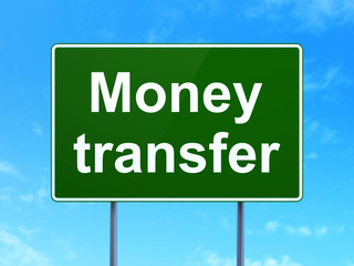 Finance concept: Money Transfer on road sign background