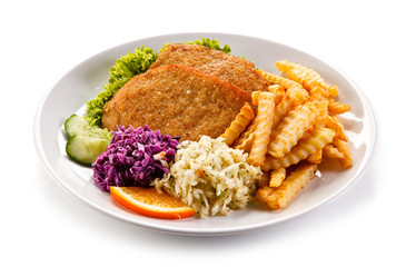 Fried pork chop, French fries and vegetables 