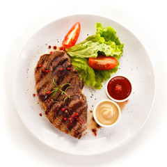 Grilled steaks and vegetables