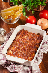 Italian cannelloni pasta baked in casserole dish