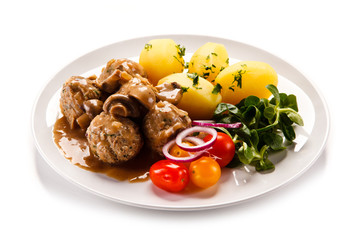 Broiled meatballs, boiled potatoes and vegetables 