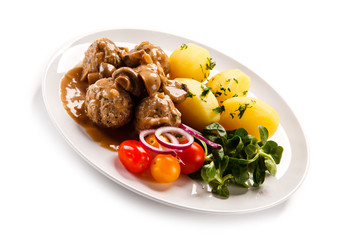 Broiled meatballs, boiled potatoes and vegetables 