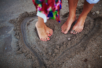 Two lovers staying on beach