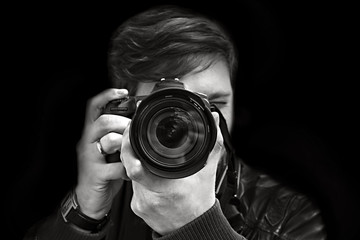 photographer takes a picture. Front view, close-up
