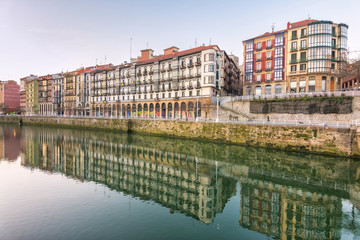 Fototapeta na wymiar reflections at vintage facades of Bilbao, Spain