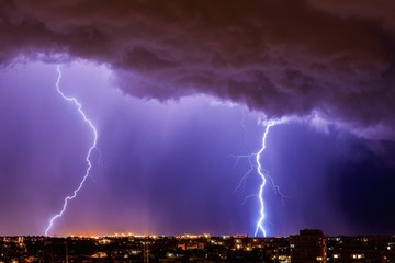 Beautiful lightning above the night city