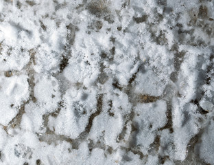 trace of the car in the snow as a background