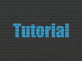 Obraz premium Learning concept: Tutorial on wall background