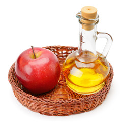 apple cider vinegar and apples isolated on white background