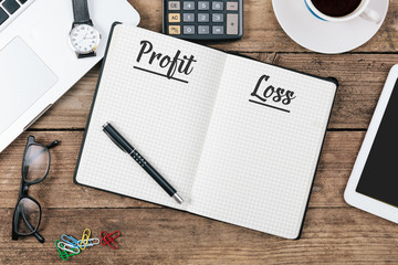 Profit and Loss on note book at office desktop
