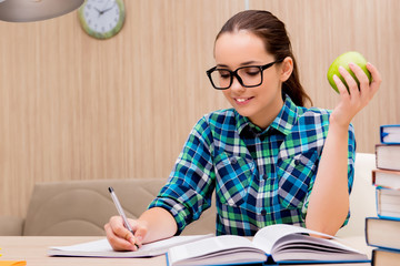 Young female student preparing for exams