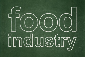 Fototapeta premium Manufacuring concept: Food Industry on chalkboard background