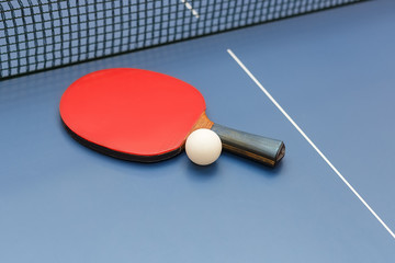 ping pong racket and ball