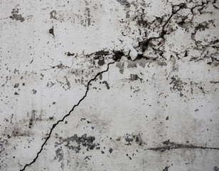 Cracked whitewashed wall with rich and various texture