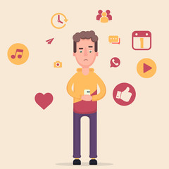 The boy is holding a phone in his hand.