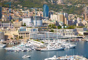 Principality of Monaco. View of the seaport and the city of Monte Carlo with luxury yachts and sail boats 