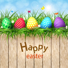 Golden Easter eggs on a wooden background