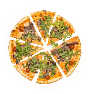 Sliced pizza with arugula isolated on white background