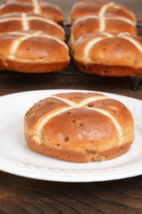 closeup hot cross bun on plate
