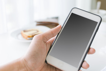 Finger touch and using smartphone with blank black screen free area space.