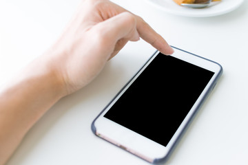 Finger touch and using smartphone with blank black screen free area space.