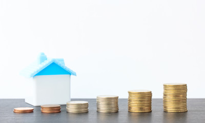 Saving to buy a house that stack  coin growing ,saving money or money growth concept