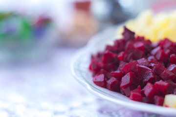 Vegetable salad with potatoes, beets, cucumber, carrots and onions