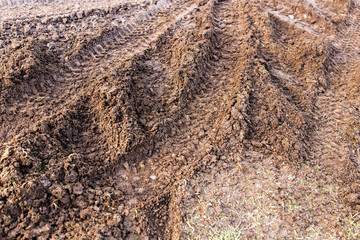 track from a car in a dirty ground