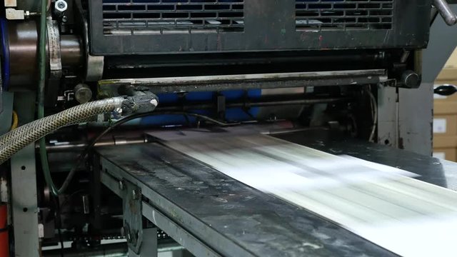 Envelopes being printed at high speed in a big factory, assembly line