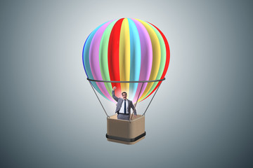 Fototapeta premium Businessman flying on balloon in challenge concept