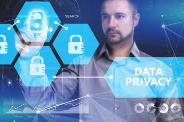 Business, Technology, Internet and network concept. Young businessman shows the word on the virtual display of the future: Data privacy