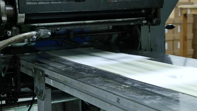 Envelopes being printed in a big factory, assembly line