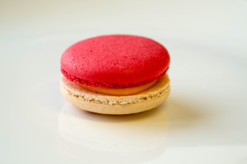 Red and cream macaroon in closeup.