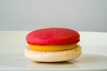 Red and cream macaroon in closeup.