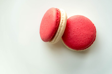 Red and cream macaroon in closeup.
