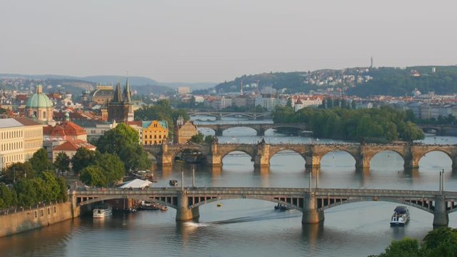 Timelapse with a lot of pedestrian passes by the Charles Bridge over the river Vitava in Prague