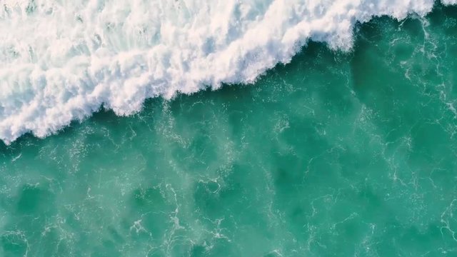 Waves breaking on a beach in Bali