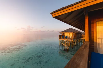 Papier Peint photo Lavable Côte Beautiful tropical Maldives resort hotel and island with beach and sea on sky sunset for holiday vacation background concept - Boost up color Processing.