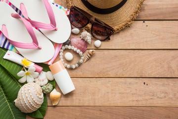 Summer holiday concept, accessories and travel items on wooden board, flat lay, top view background