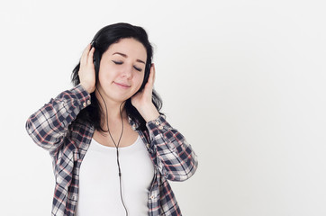 Young woman or girl listening to her favorite song closed eyes a