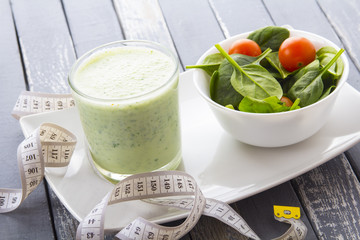 fitness concept notebook spinach salad cocktail vitamins benefit health tomatoes vegetables
